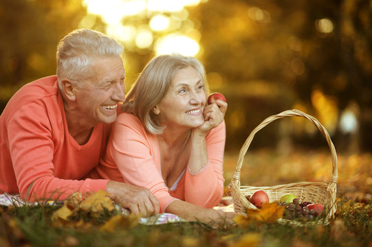 Couple in autumn park - Powered by Adobe