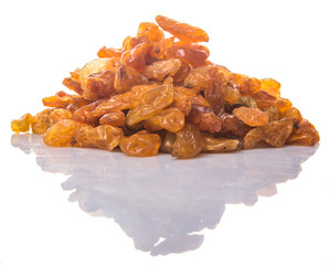 Dried orange colored raisin over white background