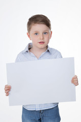 clever boy holding blank panel