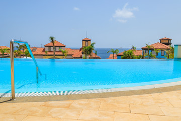 Fototapeta na wymiar Swimming pool of luxury hotel on coast of Madeira island