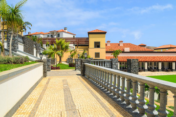 Fototapeta na wymiar Alley in gardens of luxury hotel on Madeira island, Portugal