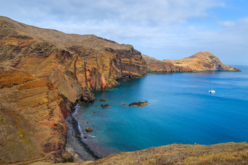 Catamaran boat in ocean bay on coast of Madeira island, Portugal