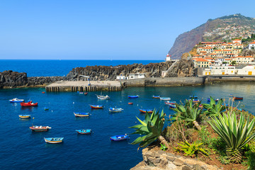 Colorful fishing boats on sea in Camara de Lobos port, Madeira