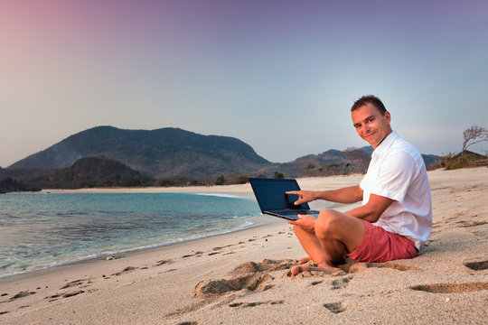 man uses laptop remotely