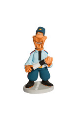 Statuette of policeman with a stick on the road