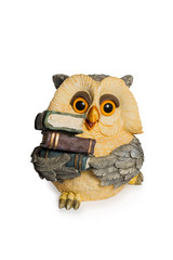Figurine owl sitting with books