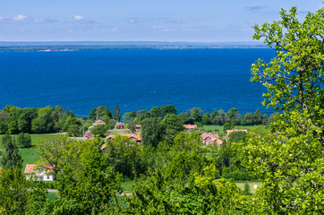 View of a lush landscape and the lake Vättern.