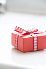 Single red gift box with  ribbon