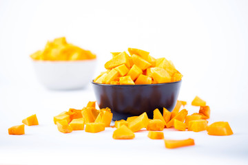 Pumpkin chunks on a bowl isolated