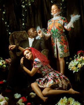 Fashion editorial with two women and one man