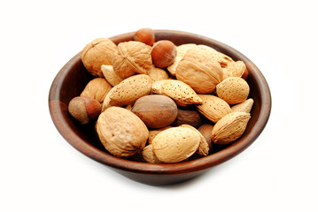 Mixed Whole Nuts in a Wooden Bowl Over White