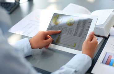 Business person analyzing financial statistics