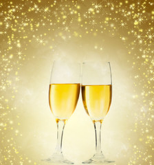 Glasses with champagne against fireworks