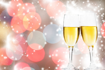 Glasses with champagne against fireworks