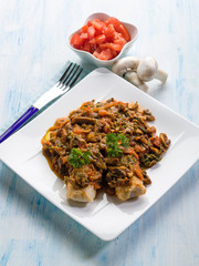 fish with mushroom and tomatoes
