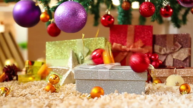Christmas presents in front of christmas tree, Slow motion.