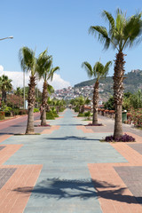 Fototapeta na wymiar Alanya - Cleopatra beach. Long boardwalk and bike path