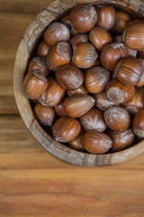Table top view over bowl with hazelnuts