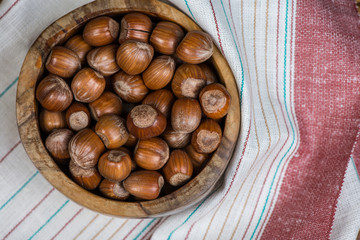 Table top view over bowl with hazelnuts