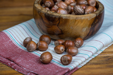 bowl with hazelnuts on kitchen cloth
