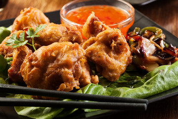 Fried chicken pieces in batter