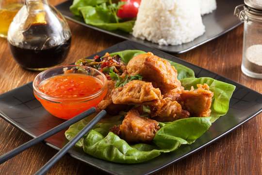 Fried chicken pieces in batter