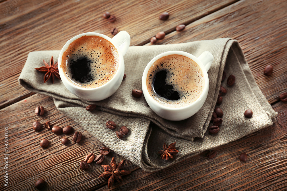 Wall mural two cups of coffee on wooden table