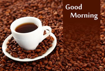 Cup of coffee on coffee beans background