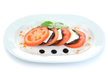 Eggplant salad with tomato and feta cheese, isolated on white
