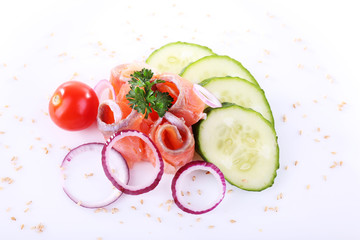 Appetizing fish salad with vegetables on plate isolated on