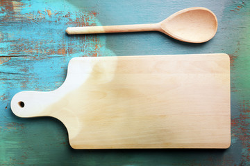 Empty cutting board on wooden background