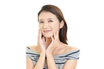 Fototapeta premium フェイスケアをする女性