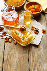 Fresh honey on wooden table