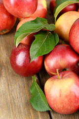 Ripe red apples on wooden background