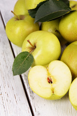 Ripe green apples on wooden background