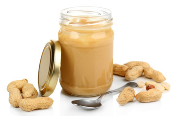 Creamy peanut butter in jar, isolated on white