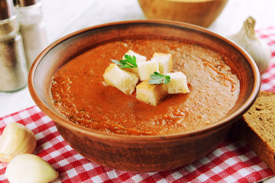 Delicious lentil cream-soup on table close-up