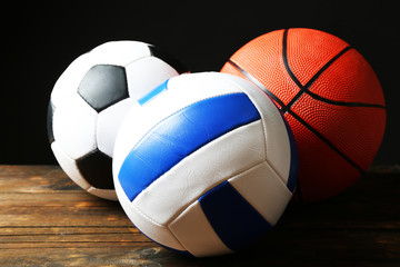 Sports balls on black background