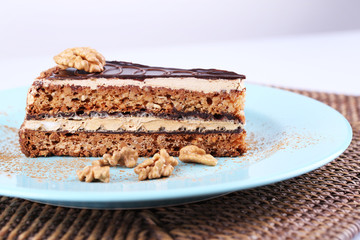 Delicious chocolate cake on plate on table close-up