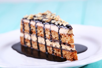 Delicious chocolate cake on plate on table close-up