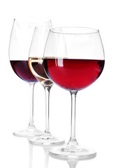 Wineglasses with red and white wine isolated on white