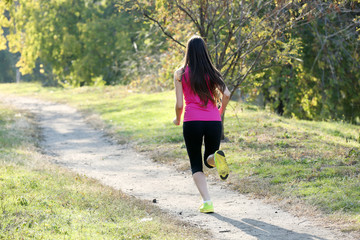 Young woman jogging at park