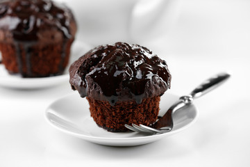 Yummy chocolate cupcake on table, close-up