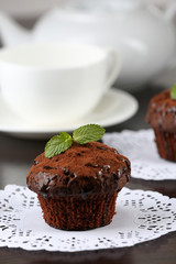 Yummy chocolate cupcake on table