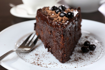 Yummy chocolate cake served on table, close-up