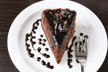 Yummy chocolate cake served on table, close-up