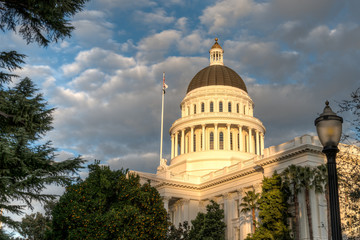 California Capitol building lit by setting sun