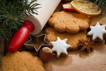 Fototapeta na wymiar Assorted Christmas cookies, spices on wooden board