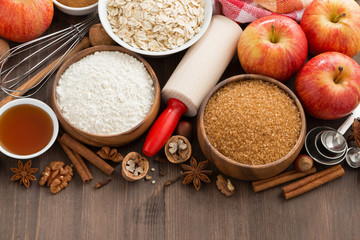 ingredients for baking cake on a wooden background, top view