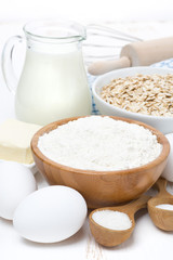 milk, cereal and ingredients for baking, close-up